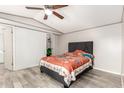 Bright bedroom with a gray headboard bed and light-colored wood-look flooring at 5601 W Missouri Ave # 254, Glendale, AZ 85301