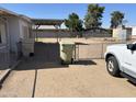 Exterior view featuring a fenced yard and partial view of a vehicle, adding convenience at 6935 W Zoe Ella Way, Peoria, AZ 85382