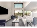Comfortable living room with large windows overlooking the golf course at 7222 E Gainey Ranch Rd # 140, Scottsdale, AZ 85258