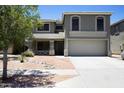 Beautiful two-story home with desert landscaping, a covered porch, and a spacious driveway at 8514 S 49Th Dr, Laveen, AZ 85339