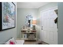 Bright entryway features a console table and a white front door creating a welcoming ambiance at 930 N Mesa Dr # 1045, Mesa, AZ 85201