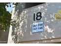 Close-up view of condo building showing unit number 18 and associated unit numbers at 9600 N 96Th St # 267, Scottsdale, AZ 85259