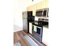 Well-equipped kitchen features stainless steel appliances and neutral cabinetry at 9600 N 96Th St # 267, Scottsdale, AZ 85259