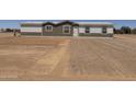 A cozy single-story home boasting a simple exterior design and a clean, gravel-covered front yard leading to the entrance at 10150 E Shallow Canyon Rd, San Tan Valley, AZ 85143