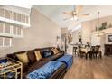 Inviting living room featuring a spiral staircase, comfortable seating, and open floor plan at 10301 N 70Th St # 223, Paradise Valley, AZ 85253