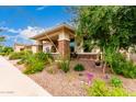 Charming single-story home featuring a welcoming front porch and xeriscaped front yard at 10545 E Texas Ave, Mesa, AZ 85212