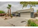Well-maintained single-story home with desert landscaping and a convenient two-car garage at 10760 W Encanto Blvd, Avondale, AZ 85392