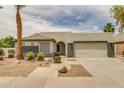 Inviting single-story home with desert landscaping and a convenient two-car garage at 10760 W Encanto Blvd, Avondale, AZ 85392