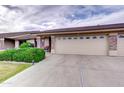 Home with a two car garage, stone accents and large front yard at 11069 E Kilarea Ave # 194, Mesa, AZ 85209