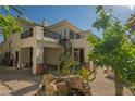 Charming backyard featuring a spiral staircase, balcony, and stucco exterior at 11446 E Sweetwater Ave, Scottsdale, AZ 85259