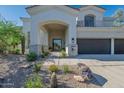 Inviting front entrance with desert landscaping and a welcoming facade at 11446 E Sweetwater Ave, Scottsdale, AZ 85259