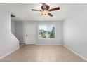 Bright living room featuring neutral paint, tile floors, and natural light at 19601 N 7Th N St # 1072, Phoenix, AZ 85024