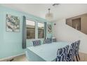 Bright dining room features blue accent wall, table, chandelier, and neutral tile at 21610 N Bradford Dr, Maricopa, AZ 85138