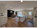 Modern kitchen open to dining area, featuring an island with seating, sleek appliances, and ample counter space at 2337 E Manhatton Dr, Tempe, AZ 85282