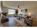 Well-lit living room with elegant decor, comfortable seating, and a view of the neighborhood, creating a cozy atmosphere at 2337 E Manhatton Dr, Tempe, AZ 85282