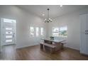Bright dining area with modern lighting and a view of the front yard at 2345 N 28Th Pl, Phoenix, AZ 85008
