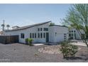 The exterior showcases a modern design with gravel landscaping and a unique roofline at 2345 N 28Th Pl, Phoenix, AZ 85008