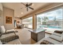 Relaxing covered patio with plenty of seating and a view of the pool at 2959 W Eastman Dr, Anthem, AZ 85086