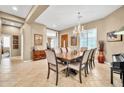 Formal dining room featuring a chandelier, tile flooring, and seating for eight guests at 2959 W Eastman Dr, Anthem, AZ 85086