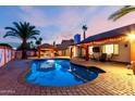 Beautiful swimming pool, BBQ and outdoor seating area at dusk at 3037 E Mallory St, Mesa, AZ 85213