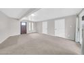 Large living area featuring new carpet, modern paint, and two entry doors at 3124 W Port Royale Ln, Phoenix, AZ 85053