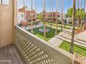 Balcony view overlooking a well-maintained courtyard with lush greenery and a central fountain at 3500 N Hayden Rd # 206, Scottsdale, AZ 85251