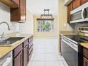 Well-lit kitchen featuring stainless steel appliances, granite countertops, and stylish backsplash at 3500 N Hayden Rd # 206, Scottsdale, AZ 85251