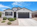 Well-maintained single-Gathering home with desert landscaping, a two-car garage and covered entryway at 35585 W San Alvarez Ave, Maricopa, AZ 85138