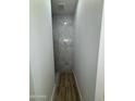 Bathroom boasting a tiled shower with modern fixtures at 3627 W Palmaire Ave, Phoenix, AZ 85051