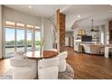 Bright open living space with exposed stone column, wood floors, and many windows at 40858 N 109Th Pl, Scottsdale, AZ 85262