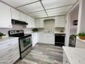 Bright kitchen with sleek appliances, ample counter space, and wood-look floors at 425 S Parkcrest -- # 323, Mesa, AZ 85206