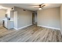 Inviting living room featuring modern flooring, neutral paint, and an open layout to the kitchen at 5222 N 41St Ave, Phoenix, AZ 85019