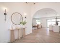 Bright entryway with herringbone floors, modern decor, and an open view into the living spaces at 6529 E Eugie Ter, Scottsdale, AZ 85254