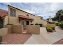 Charming condo with stucco walls, red tile roof, and gated front courtyard at 6533 N 7Th Ave # 18, Phoenix, AZ 85013