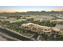 Scenic aerial view of a vibrant shopping area and mountains, with colorful buildings and lush landscaping at 7180 E Kierland Blvd # 814, Scottsdale, AZ 85254
