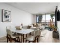 Bright living room with stylish furniture, natural light, and picturesque mountain view through the glass doors at 7180 E Kierland Blvd # 814, Scottsdale, AZ 85254