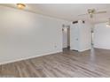 Spacious living room with neutral tones and updated flooring at 11149 W Palm Ridge Dr, Sun City, AZ 85351