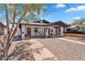 Inviting duplex features classic architectural style and easy-care landscaping at 1306 E Fillmore St, Phoenix, AZ 85006