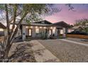 Inviting duplex features classic architectural style and easy-care landscaping at 1306 E Fillmore St, Phoenix, AZ 85006