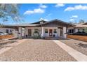 Charming duplex with individual entrances, desert landscaping, and a shared driveway at 1306 E Fillmore St, Phoenix, AZ 85006