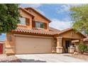 Charming two-story home featuring desert landscaping, a long driveway, and a cozy covered porch entry at 136 W Brahman Blvd, San Tan Valley, AZ 85143