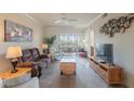 Cozy living room with plush seating, neutral tones and sliding glass doors to balcony at 1941 S Pierpont Dr # 2073, Mesa, AZ 85206