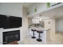 Cozy eat-in kitchen with stainless appliances, breakfast bar, and decorative hanging plants at 2020 W Union Hills Dr # 110, Phoenix, AZ 85027