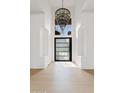 Bright foyer with high ceilings, chandelier, and modern front door at 24645 N 117Th St, Scottsdale, AZ 85255