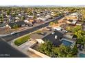 A neighborhood aerial view featuring a house with a pool and well-maintained landscaping at 2619 E Jerome Ave, Mesa, AZ 85204