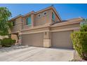 The exterior of the two-story home has a three-car garage and neutral color scheme at 3960 W Salter Dr, Glendale, AZ 85308