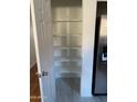 Pantry with ample shelving and access to the kitchen at 525 N Miller Rd # 239, Scottsdale, AZ 85257