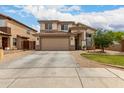 Charming two-story home with a neutral palette, tile roof, and spacious driveway providing ample parking at 6637 W Watkins St, Phoenix, AZ 85043