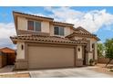 Charming two-story home with a two-car garage and well-manicured front yard at 6637 W Watkins St, Phoenix, AZ 85043