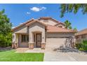 Charming home featuring a well-maintained lawn, tile roof, and an inviting two-car garage at 6847 S 27Th Pl, Phoenix, AZ 85042